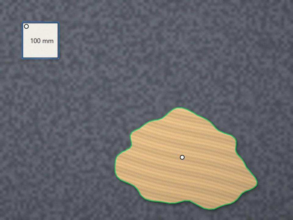 The rendered offcut on a grey bench with the 100 mm card in the top left corner; Maskbolt’s outlines are drawn over both, and two white dots mark the two clicks